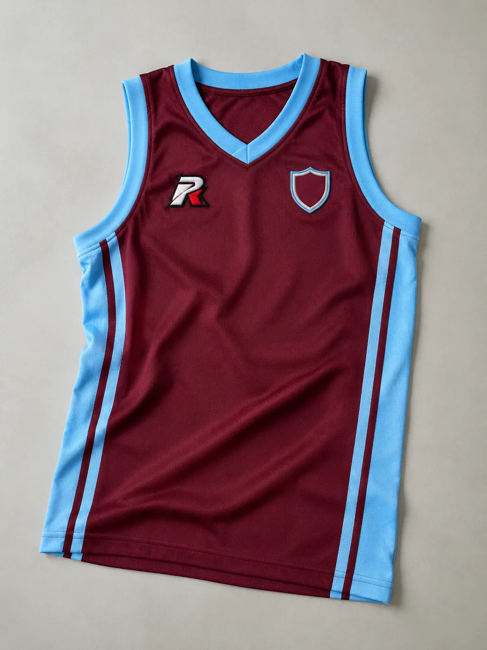 3D puff embroidery on a basketball singlet, flat lay