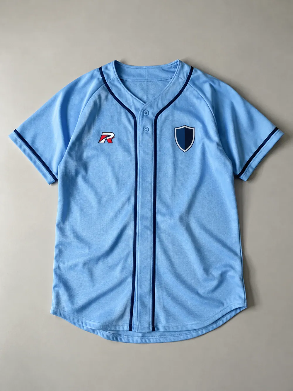 Two-button raglan jersey in powder blue, flat lay
