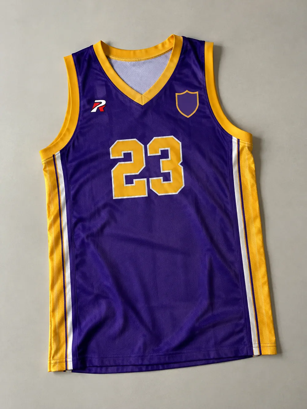 Purple/gold singlet with tackle-twill 23, front