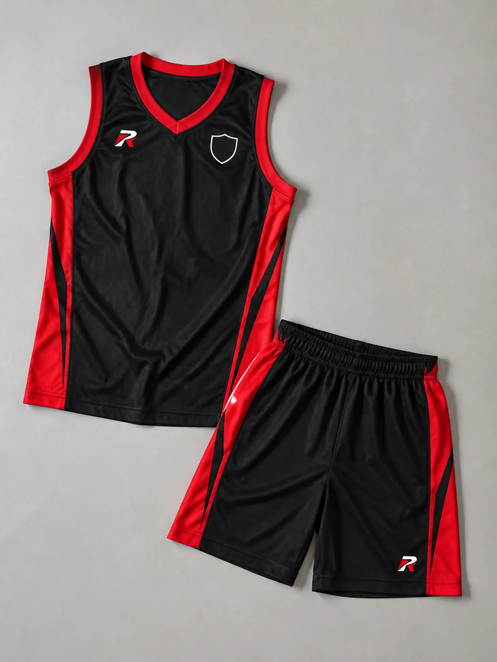 Black and red uniform with side-panel shorts, flat lay