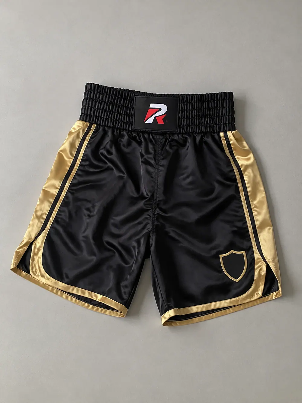 Black/gold satin trunks with wide waistband