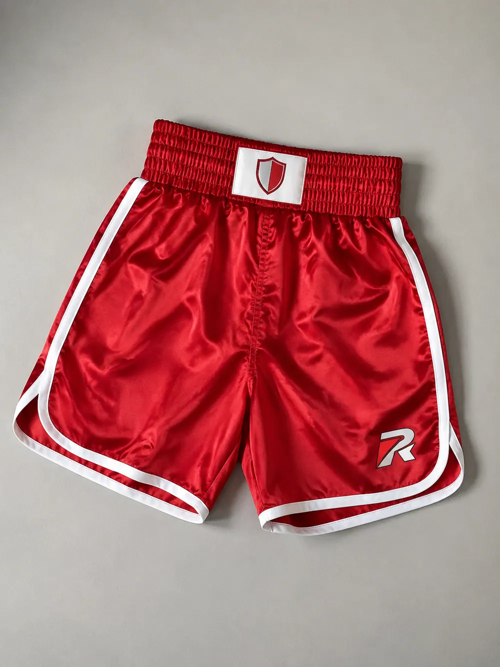 Red satin trunks with white piping