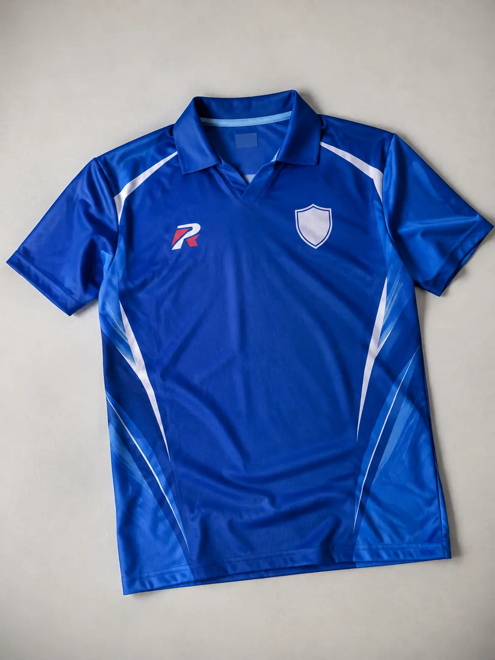 Royal blue ODI shirt with sponsor, flat lay