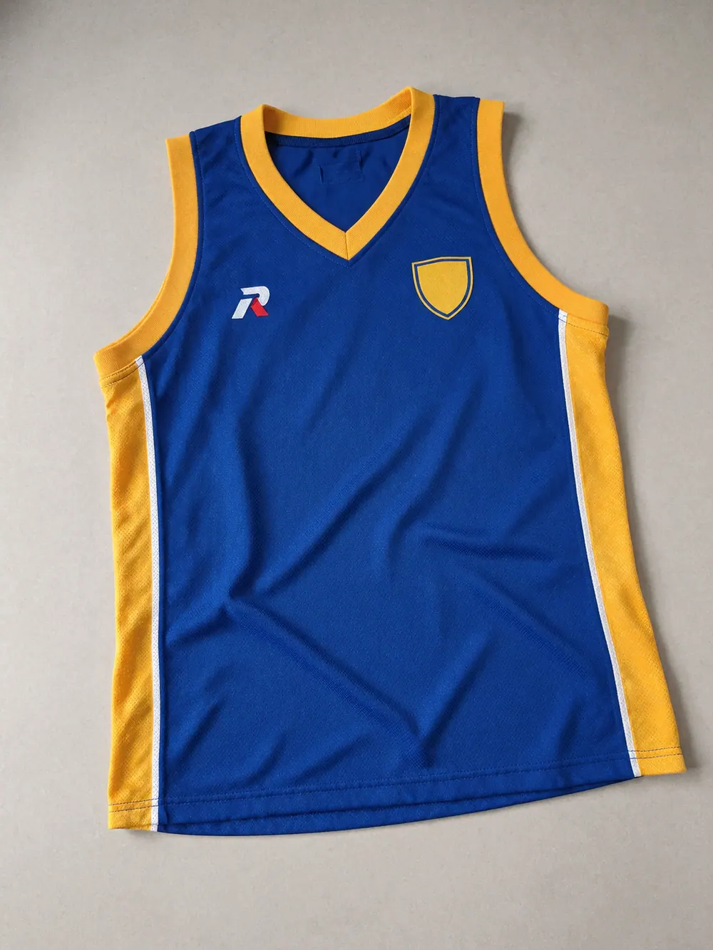 Embroidery on a basketball singlet, flat lay