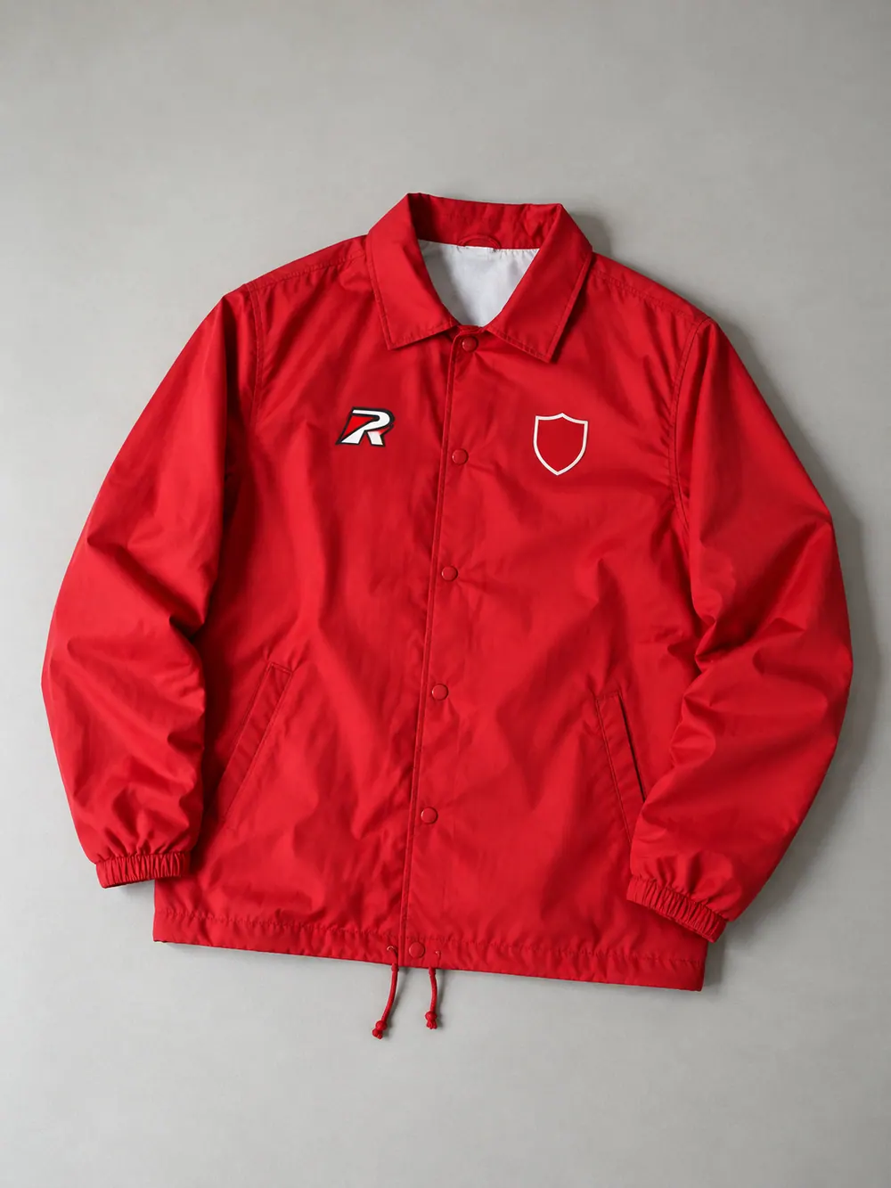 Red coaches’ jacket, flat lay