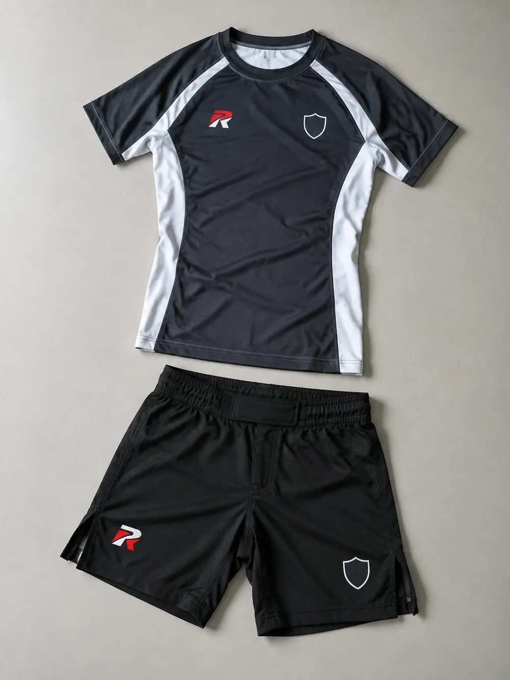 Charcoal/white rash guard and black fight shorts