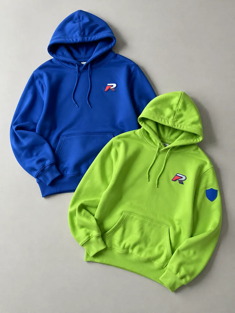Silicone & PVC badges on a hoodie, flat lay