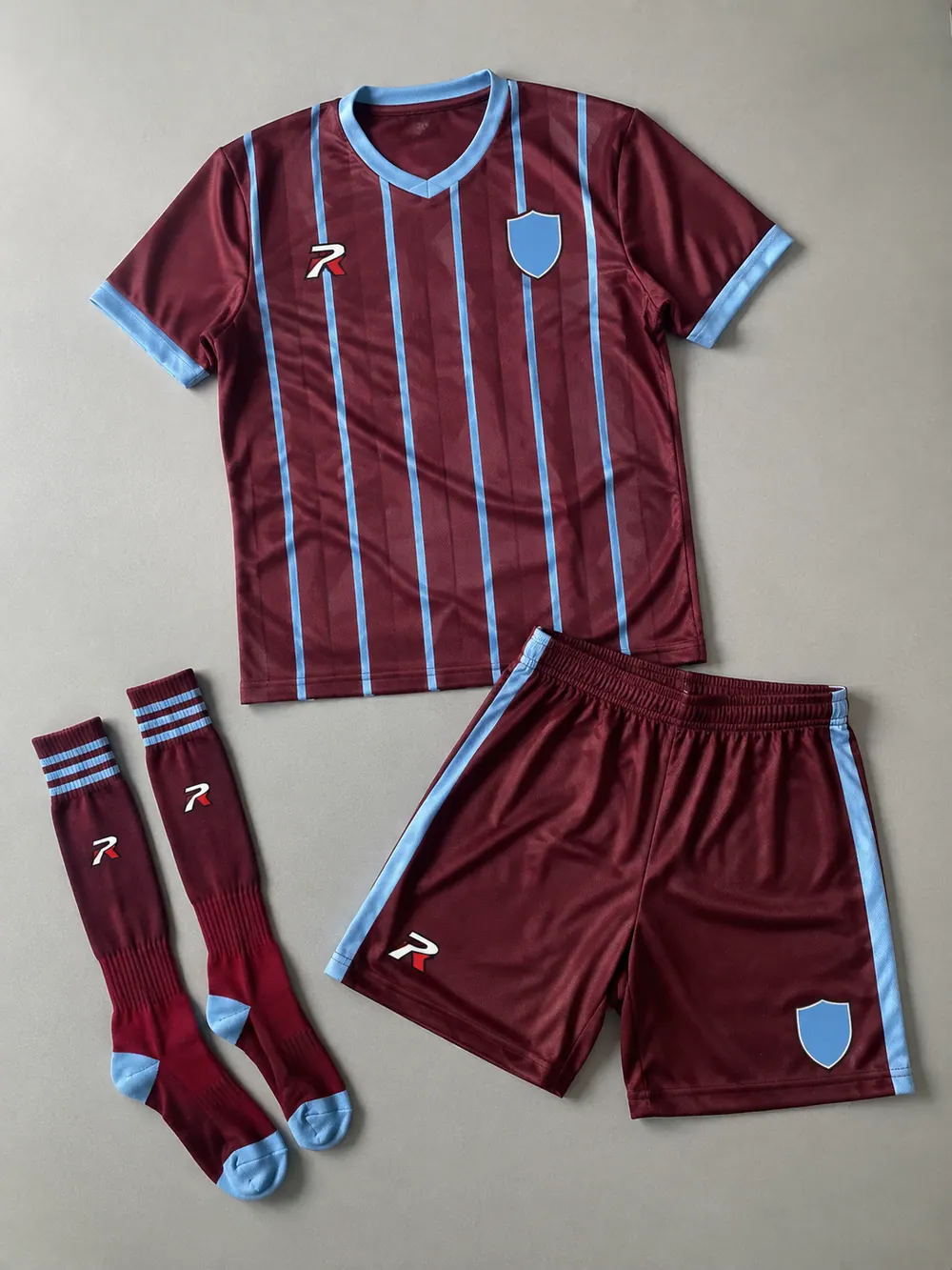 Maroon/sky-blue pinstripe home kit
