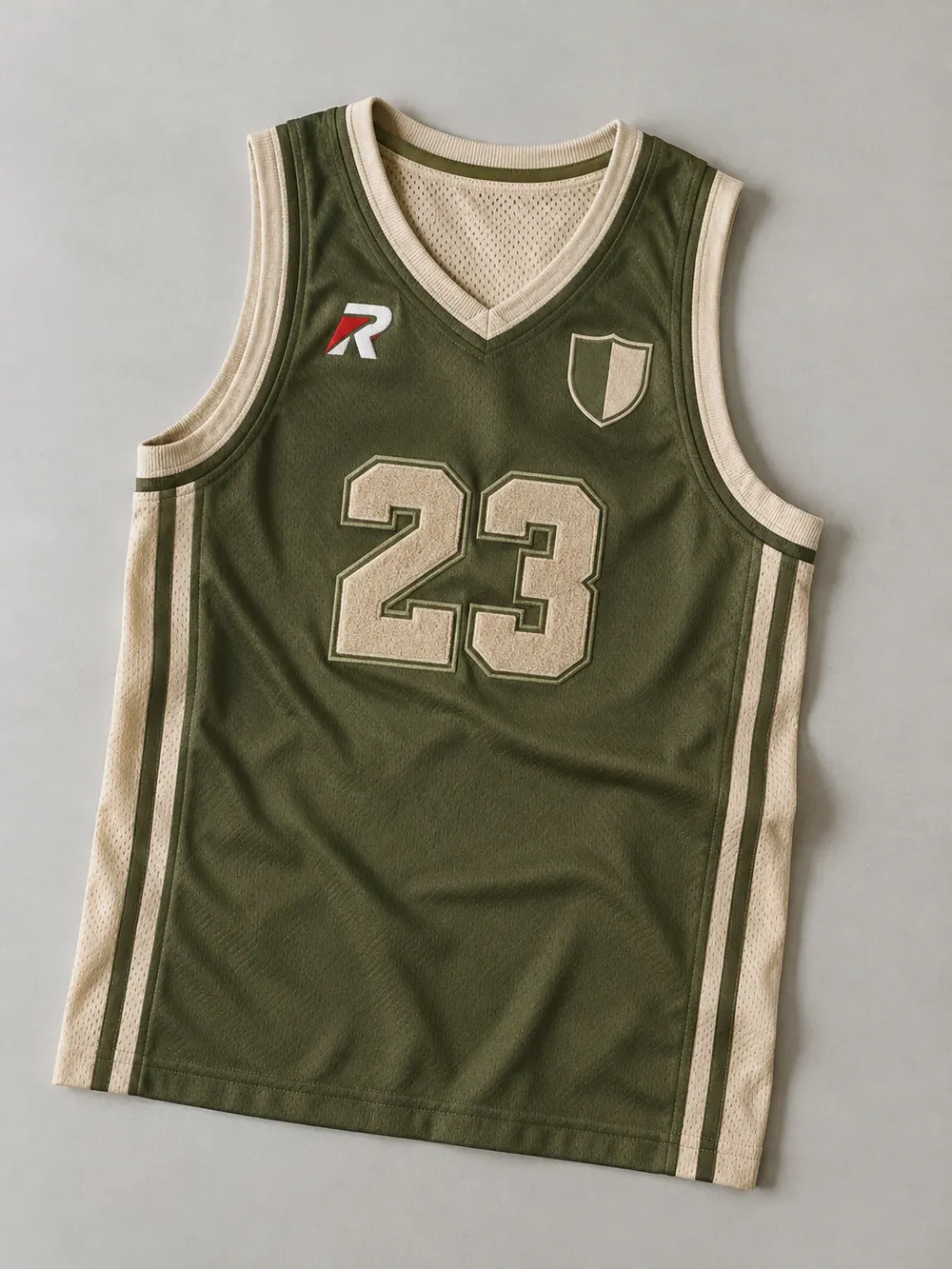 Tackle twill & chenille on a basketball singlet, flat lay
