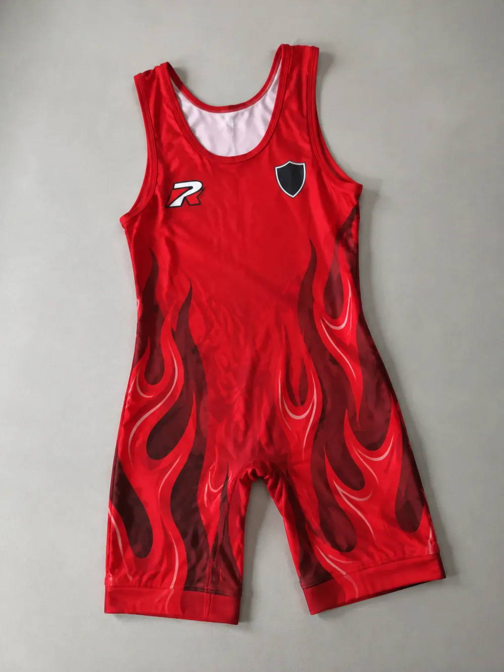 Red sublimated singlet with flames, flat lay